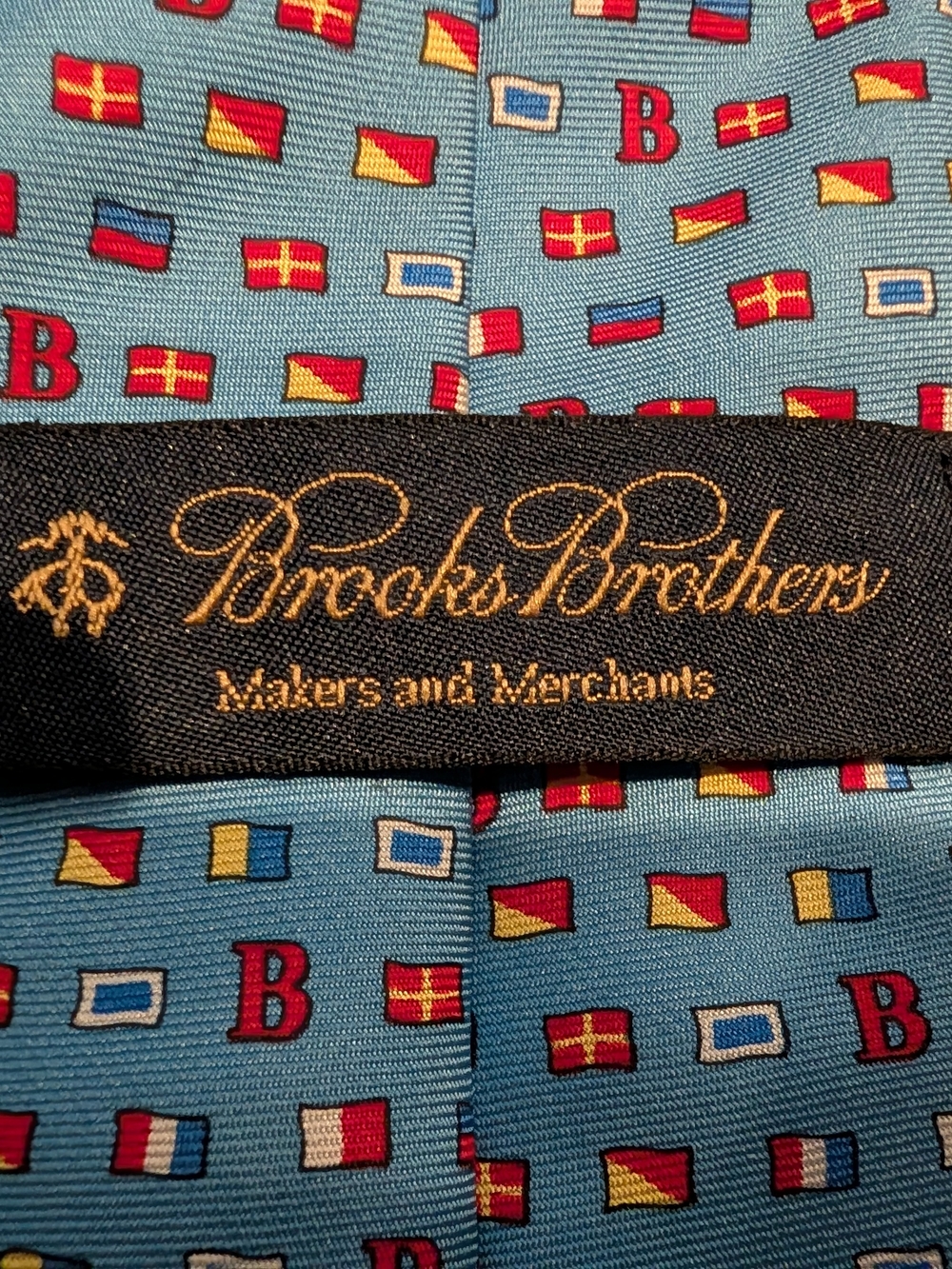 Brooks Brothers Light Blue Silk Tie with Red, Yellow and Navy Nautical Flags